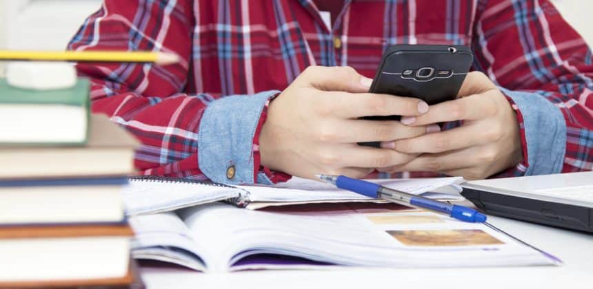 Ca student getting distracted with phone while studying