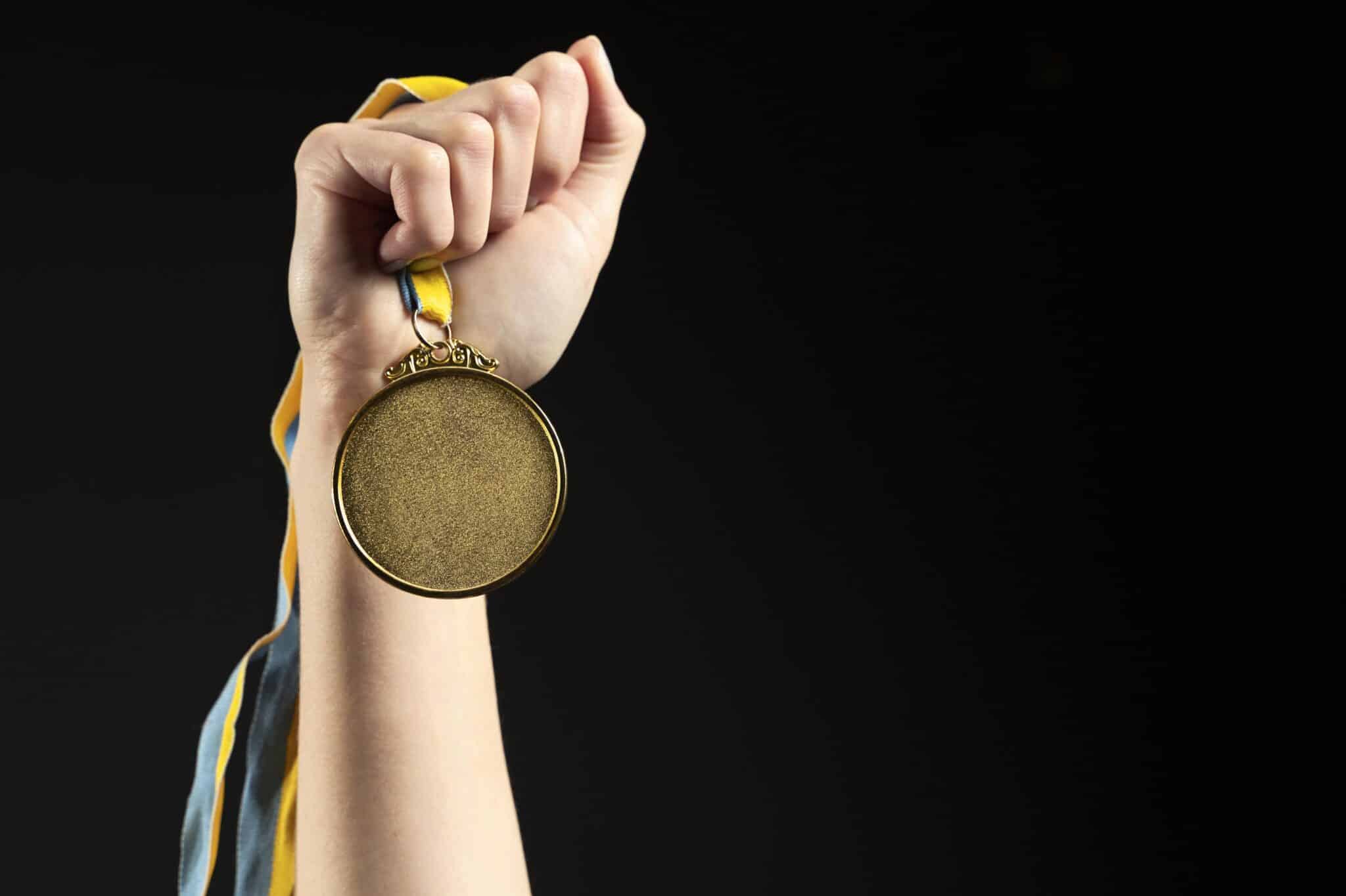 a ca student holding medal after clearing and mastering ca exam